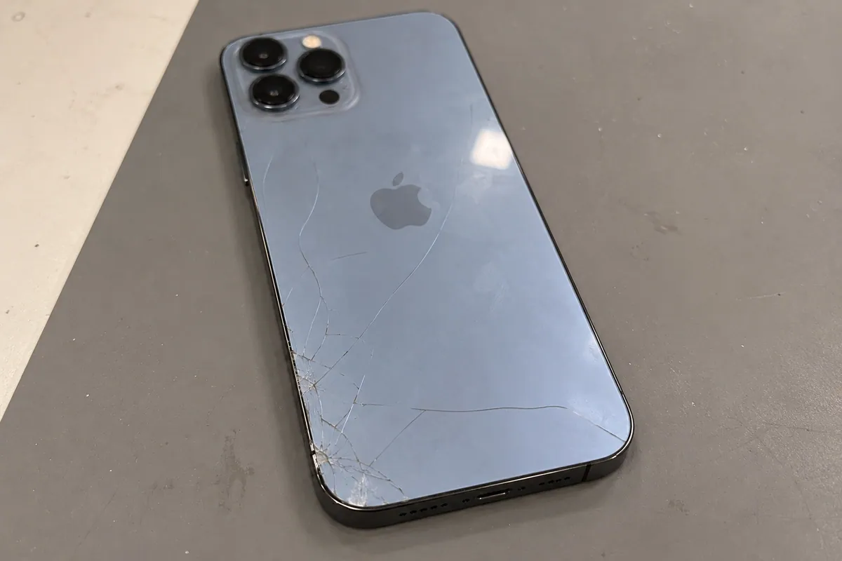 iPhone 13 Pro Max with fine rear-glass cracks before repair assessment