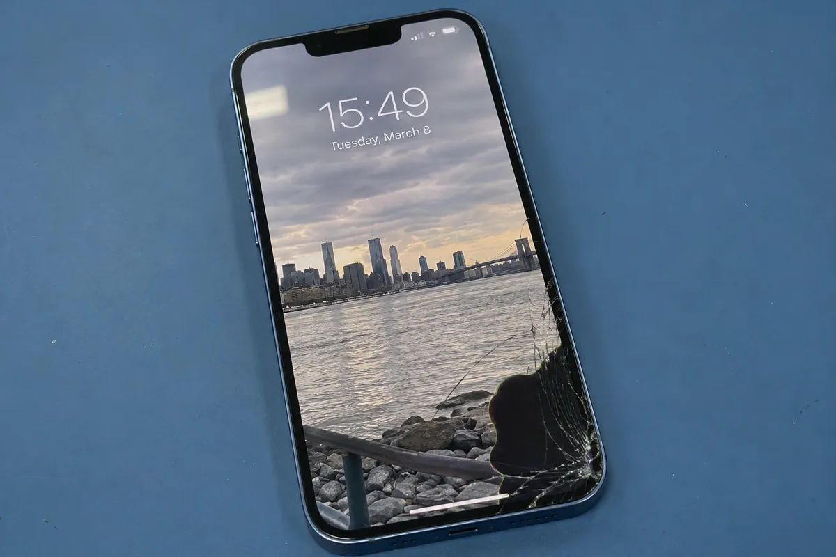 iPhone 13 Pro with cracked front glass and a damaged display area