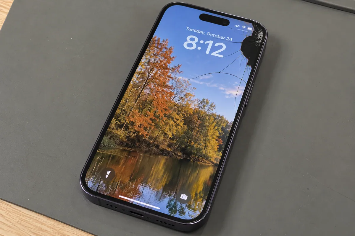 iPhone 14 Pro with cracked front glass and a damaged display area