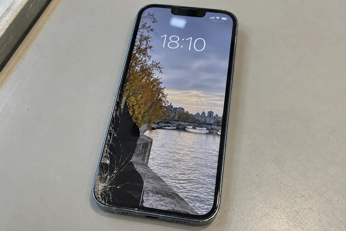 iPhone 13 Pro with cracked front glass and a damaged display area